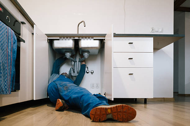 Professional Drain Cleaning technician working in Russell, AR